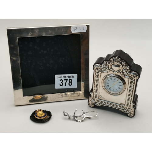 378 - silver picture frame, Brooch, Civil Defence Badge and a small clock