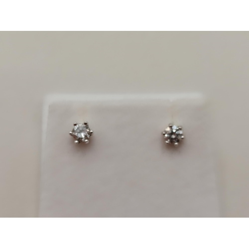 403 - A Lovely pair of 18ct Gold Diamond stud earrings