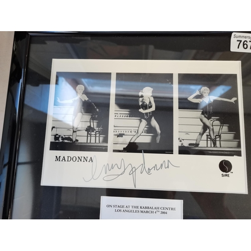 767 - 2 x framed Madonna photographs 