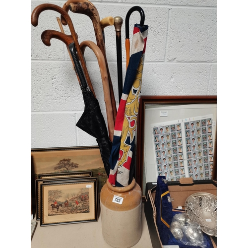 783 - Stoneware pot with walking canes and flag