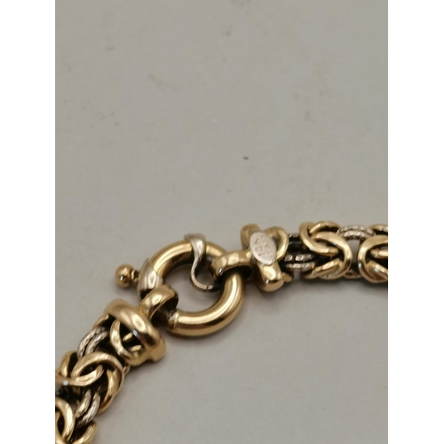 479 - A 14k gold bracelet highly decorative with loop faster 14g