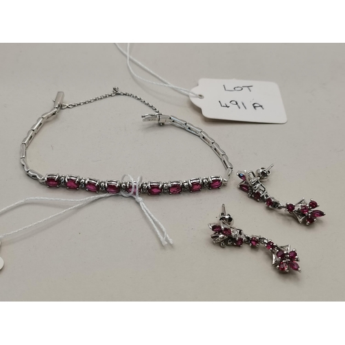 491a - 18k white gold and ruby bracelet and matching earrings