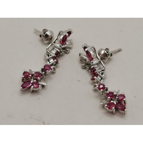 491a - 18k white gold and ruby bracelet and matching earrings