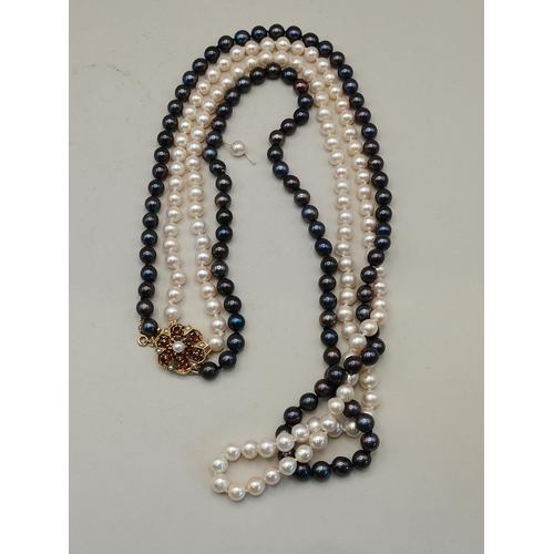 400c - A pair of pearl drop earrings plus 2 strand black and white pearl necklace