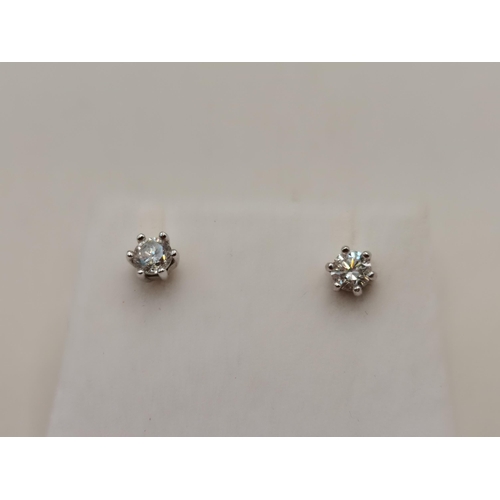 403 - A Lovely pair of 18ct Gold Diamond stud earrings