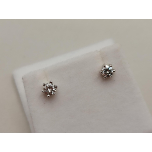 403 - A Lovely pair of 18ct Gold Diamond stud earrings