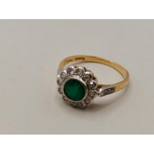 409 - 18ct Gold and platinum ring with Emerald centre stone and surrounded with Diamonds size Q