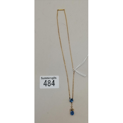 484 - Gold and diamond and blue stone necklace