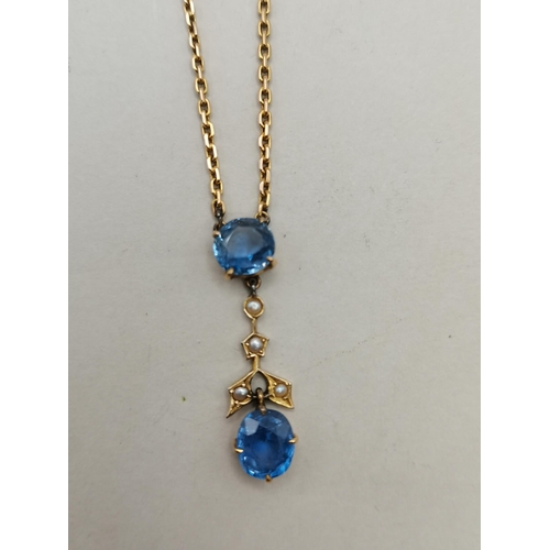 484 - Gold and diamond and blue stone necklace