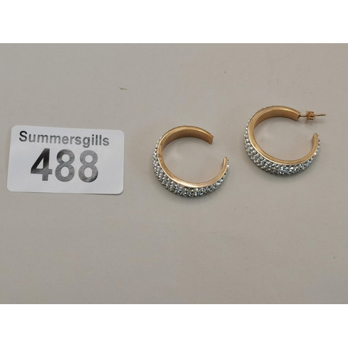 488 - A Pair of Diamond hoop earrings set in 9ct Gold (1 D/D)