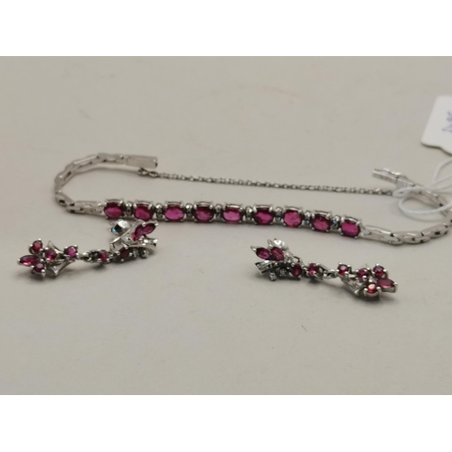 491a - 18k white gold and ruby bracelet and matching earrings