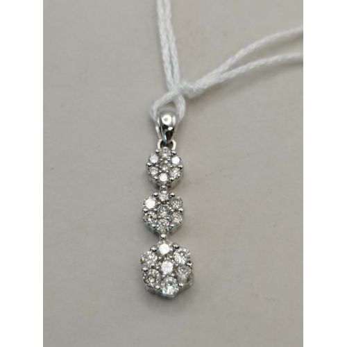 521 - 10k white gold pendant with 3 floral diamond drops made up of 7 diamonds to each