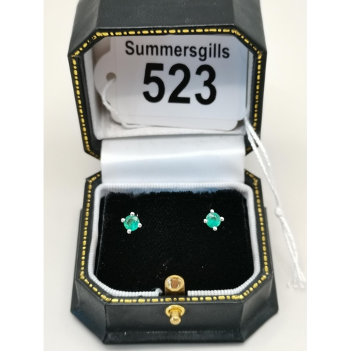 523 - A pair of single stone Emerald stud earring set in 18ct White gold