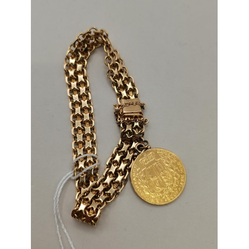 537d - A 14k gold bracelet with 1842 gold sovereign 1842 attached 32g total