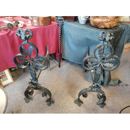 577 - A Pair of Large cast iron rests H92cm x W67cm