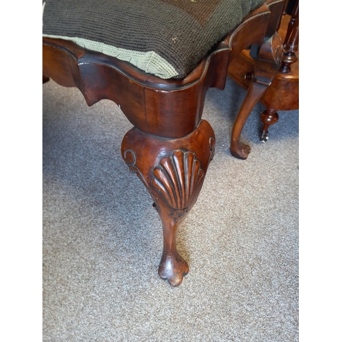 596 - An Antique walnut dressing stool with Queen Anne style legs and tapestry seat