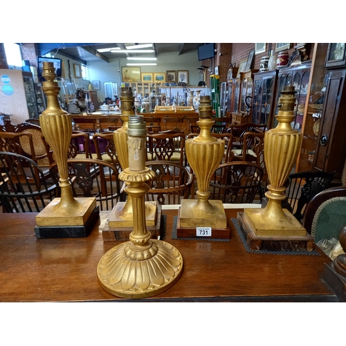 731 - A collection of wooden Gilt table lamps