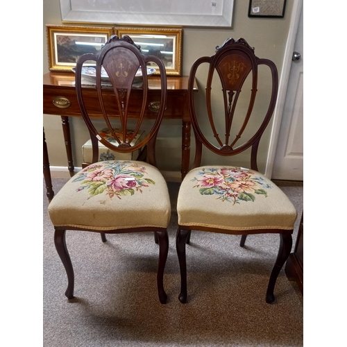 740 - A pair of Edwardian inlaid hall chairs