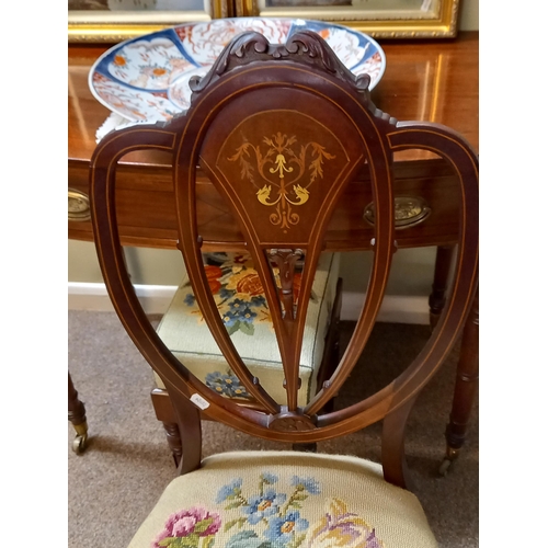 740 - A pair of Edwardian inlaid hall chairs