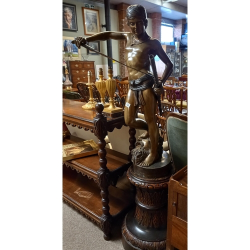 745 - A 6ft bronze statue of David and Goliath on a Victorian carved plinth