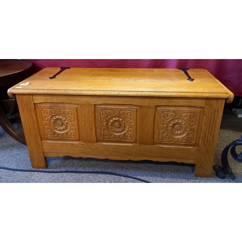 746 - An oak carved blanket box in Yorkshire oak style