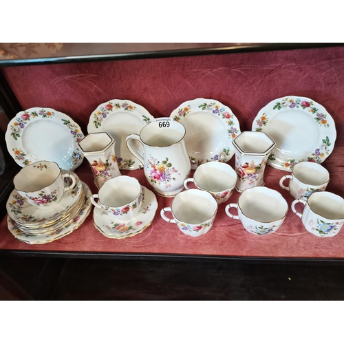 669 - A collection of Royal Crown Derby cups x7, saucers x8, side plates x6 and vases x3