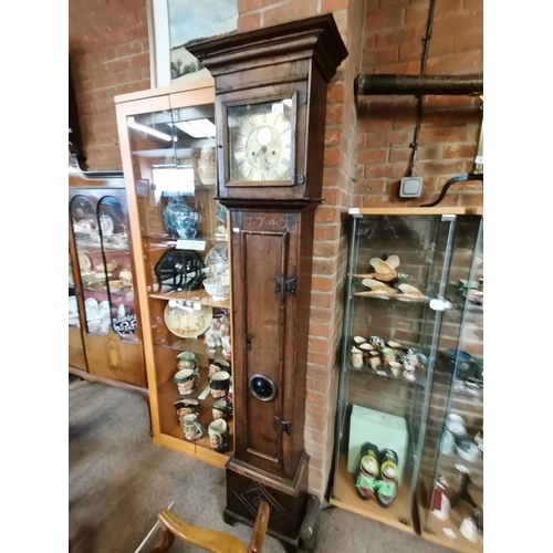 672 - An early oak grand father clock by William Pridgin of Hull marked 1740 and having a glass bulls eye ... 