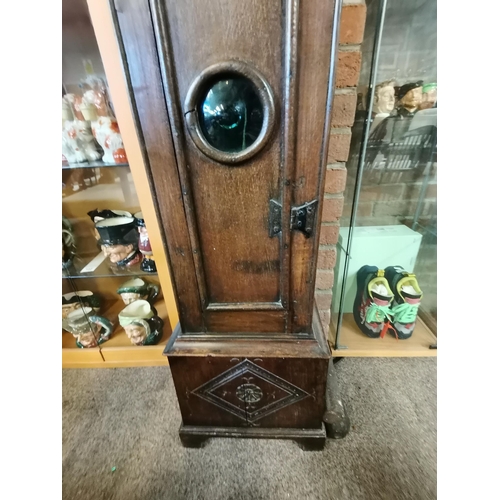 672 - An early oak grand father clock by William Pridgin of Hull marked 1740 and having a glass bulls eye ... 