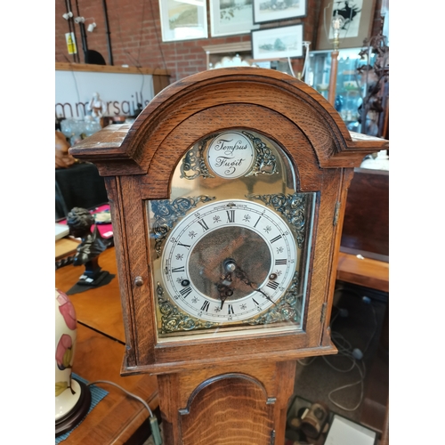 597 - Oak cased Grandmother clock marked Tempus Fugit