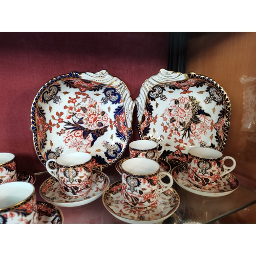 662 - A selection of Crown Derby Plates, Cups, Saucers and serving bowls including x6 cups and matching sa... 