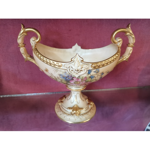 665 - Royal Worcester Blush Ivory Boat shaped twin handled pedestal vase. W23cm x H20cm x D10cm