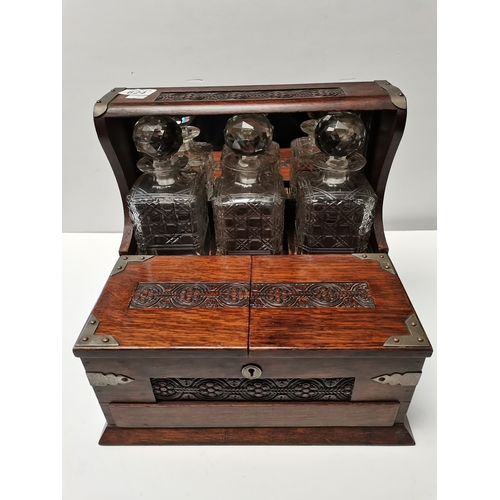 624 - Antique oak tantalus (2 x  bottles chipped )