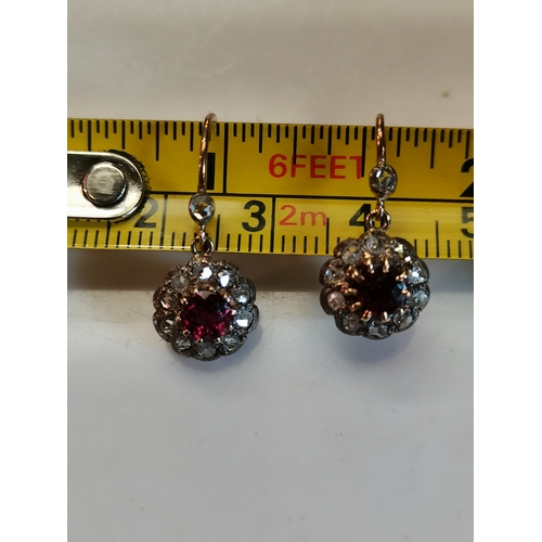 400b - Diamond and ruby earrings. Gross weight 2 grams