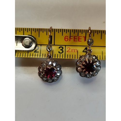 400b - Diamond and ruby earrings. Gross weight 2 grams