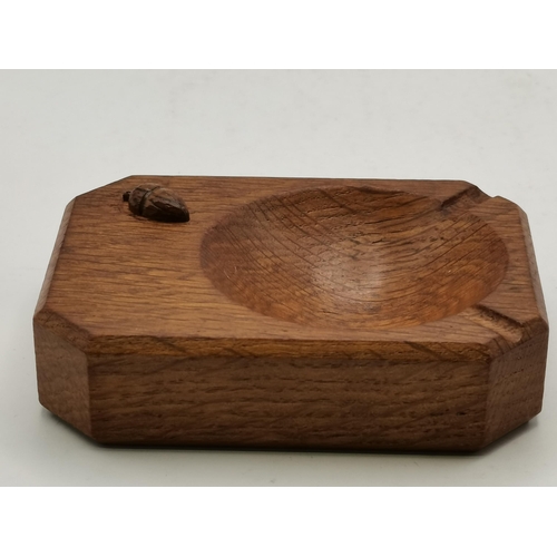 115C - Alan Grainger, an Acornman oak ashtray, of typical form, with carved acorn signature; together with ... 