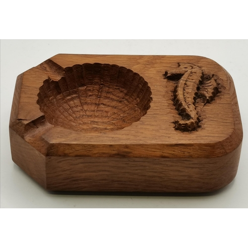 115E - Michael Riley, a Seahorseman oak ashtray, of typical form, with scalloped well and carved seahorse s... 