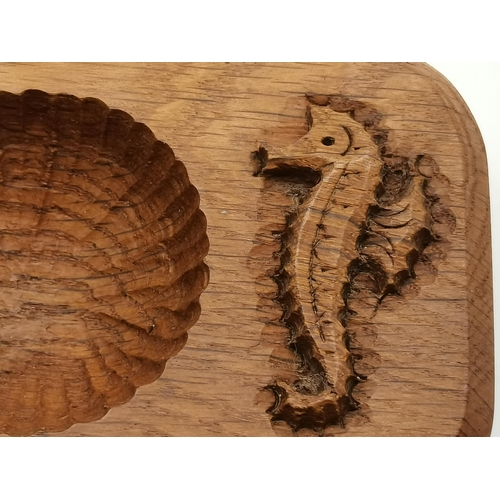 115E - Michael Riley, a Seahorseman oak ashtray, of typical form, with scalloped well and carved seahorse s... 