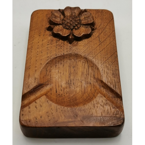 115F - Two Yorkshire oak ashtrays, of typical form, one with carved peacock signature and the other with th... 