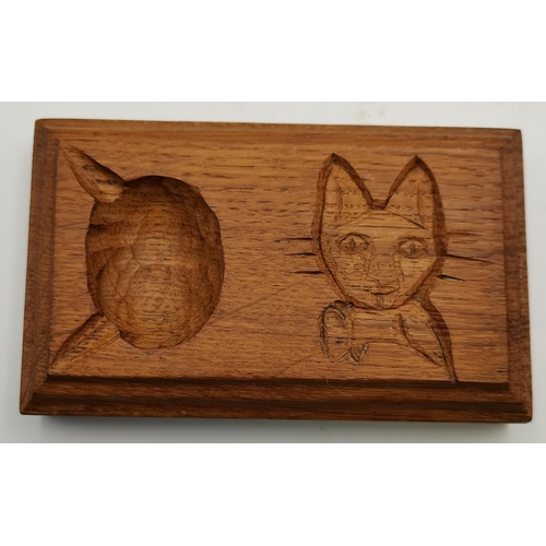 115G - Malcolm Pipes, a Foxman oak ashtray, of typical form, with carved fox head signature; together with ... 