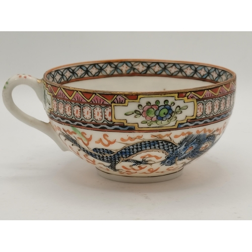 124 - A Chinese coffee set with dragon decoration 34 piece ( 1 cup broken )