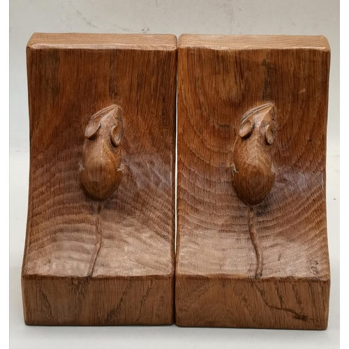 126 - Robert Thompson, a pair of Mouseman oak book ends, rectangular, lightly adzed, the curved sides each... 