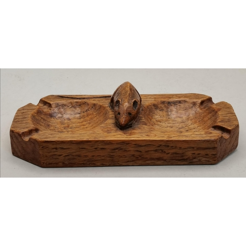 129 - Robert Thompson, a Mouseman oak twin ashtray, rectangular with canted corners, twin bowls with four ... 