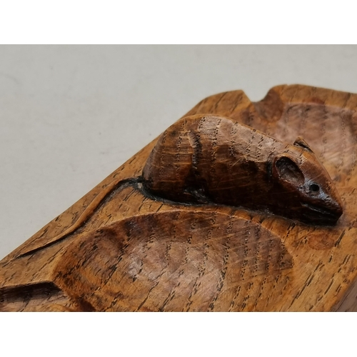 129 - Robert Thompson, a Mouseman oak twin ashtray, rectangular with canted corners, twin bowls with four ... 