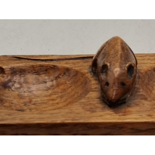 129 - Robert Thompson, a Mouseman oak twin ashtray, rectangular with canted corners, twin bowls with four ... 