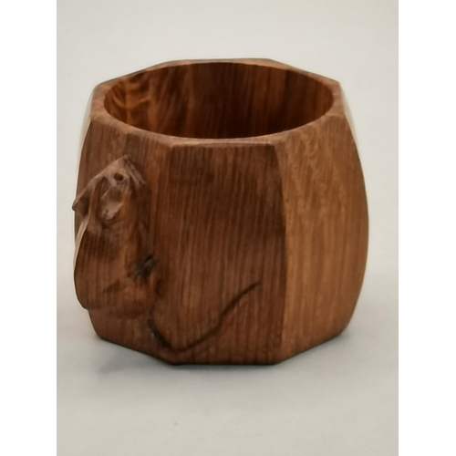 133 - Robert Thompson, a Mouseman oak napkin ring, baluster octagonal, of small proportions, with carved m... 