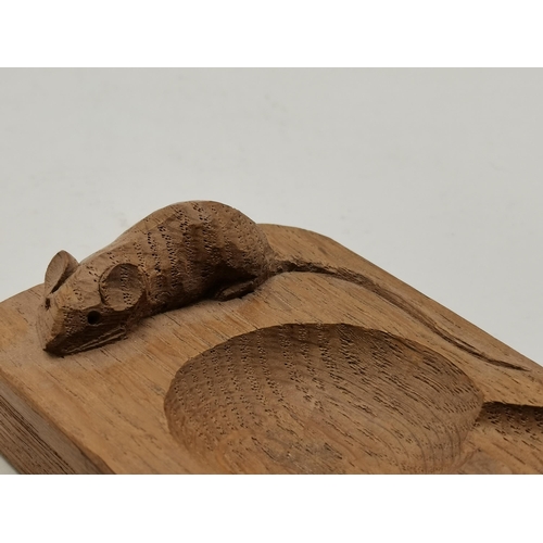 141a - Robert Thompson, a Mouseman oak ashtray, of typical form, with carved mouse signature. 10.21cm by 7.... 