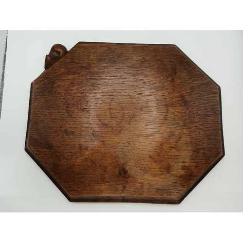 144 - Robert Thompson, a Mouseman oak bread board, elongated octagonal, lightly adzed, with carved mouse s... 