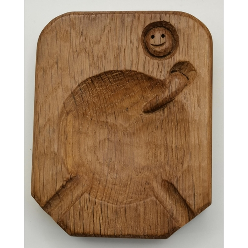 147 - Nigel Dixon, a Woodworm man oak clock, tall rectangular with flat square top; together with an ashtr... 