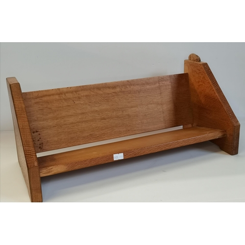 148 - Peter Heap, a Rabbitman oak book trough. 20.3cm high, 47.7cm wide, 20.6cm deep (Mouseman interest)