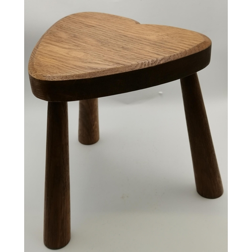 149 - A pair of oak milking stools, of small proportions, with heart-shaped seats. (2) Approx. 21cm high